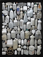 white plastic bottles on a black background